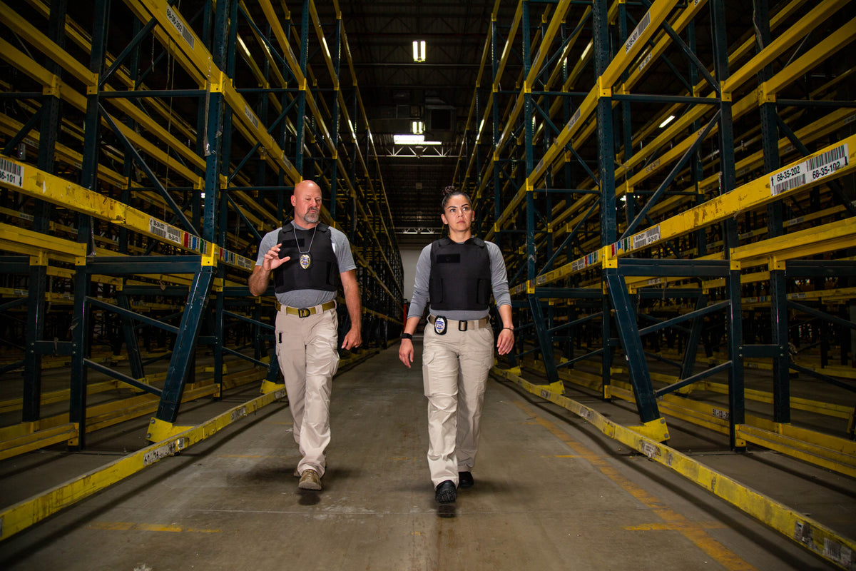 Two security officers patrolling a warehouse in BulletSafe VP3 vests